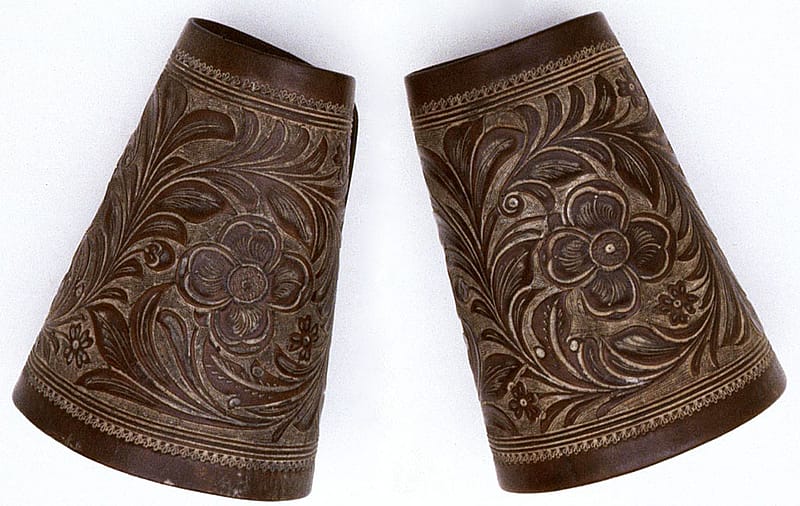 The F.A. Meanea Company of Cheyenne, Wyoming made these cuffs around 1861. Note the refined and detailed appearance of the carving. This is typical of the work done by this firm at that time. 1.69.1486a/b