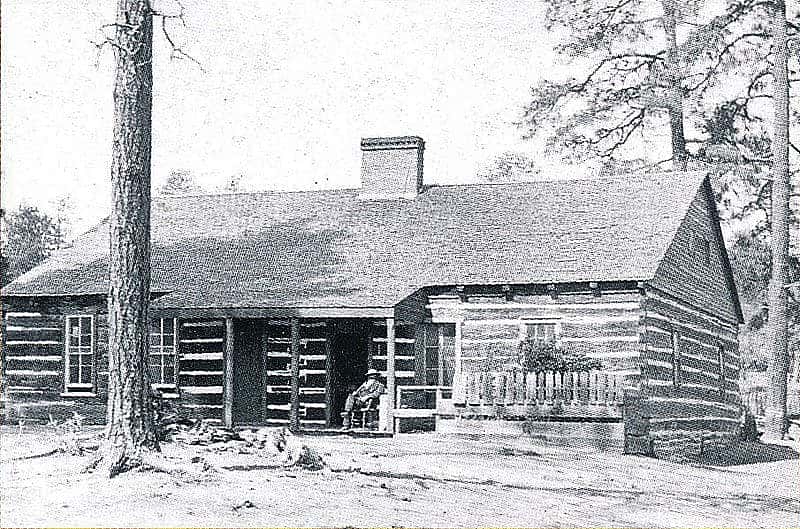 Henry Fleury smoking his pipe on the porch of the former Arizona Territorial Governor's Mansion in Prescott, circa 1890. Almost forty years later, this would become a museum of the pioneer experience established by Sharlot Hall. Sharlot Hall Museum Photo, Prescott, Arizona. Bu-G-534-pd