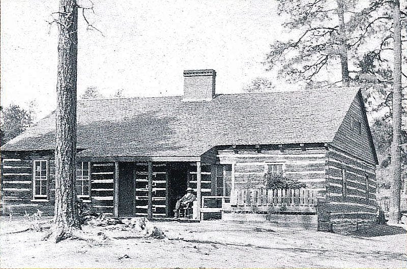 Henry Fleury smoking his pipe on the porch of the former Arizona Territorial Governor's Mansion in Prescott, circa 1890. Almost forty years later, this would become a museum of the pioneer experience established by Sharlot Hall. Sharlot Hall Museum Photo, Prescott, Arizona. Bu-G-534-pd