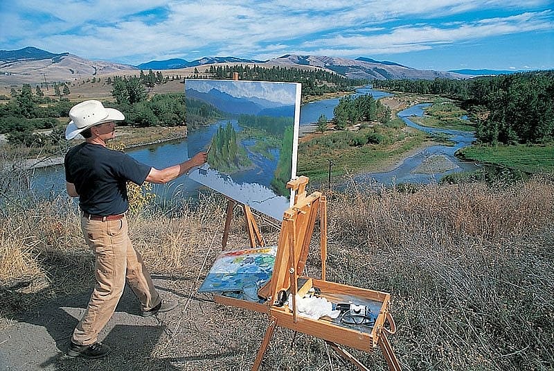 Artist Charles Fritz painting near Travelers Rest.
