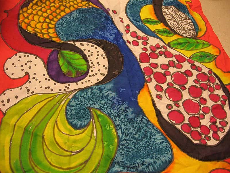 Bold and colorful hand-dyed bandana with abstract nature-inspired patterns, created during the Art-in-the-Garden event at the Buffalo Bill Center.