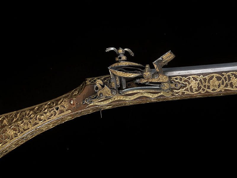 Closeup of the firing mechanism of the seven-foot-long gold Miquelet lock musket that belonged to Thomas Jefferson