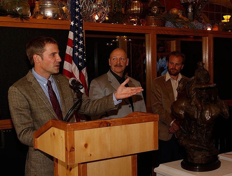 Arthur Middleton accepts the Camp Monaco Prize while Dr. Charles R. Preston and co-winner Joe Riis look on.