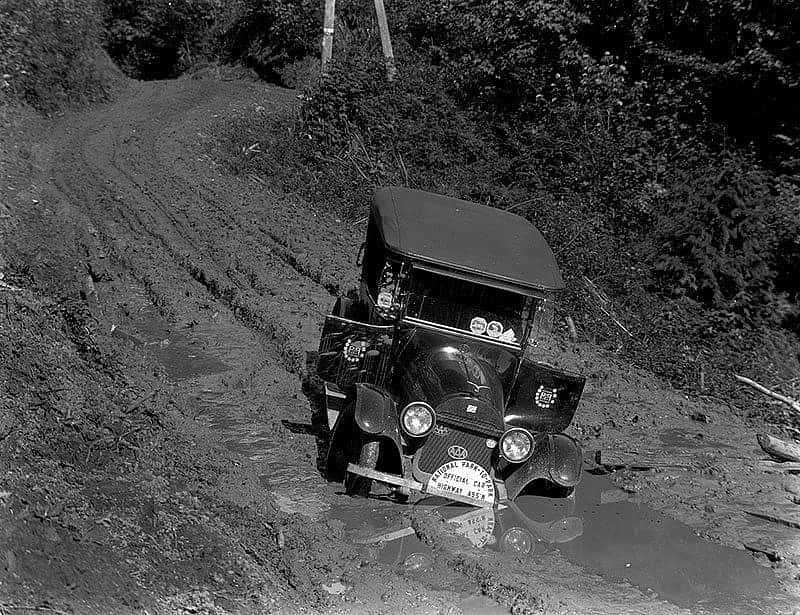 "National Park-to-Park Official Car in mudhole." Yellowstone National Park Collection MS21.15.28.1