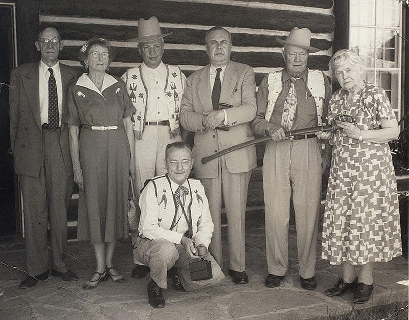 Cody family members as well as the general public donated materials to the Buffalo Bill Museum. Here, Harvey P. Cody presents Ned Buntline's Civil War sword to Mary Jester Allen at the 1953 Cody Family Reunion. Present are, left to right, Dr. and Mrs. Frank McClanahan, Hiram S. Cody, Ernest W. Cody, Harvey P. Cody, Mary Jester Allen, and Joe Hufford (kneeling). Jack Richard Photo. Mary Jester Allen Collection. P.41.501
