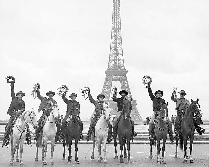Treasures from Our West: Charles Belden photo of cowboys in front of the Eiffel Tower. P.67.1580