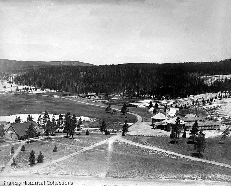 View from Old Faithful Inn of Upper Geyer Basin with buildings including Swimming Pool, Haynes Photo Shop and Ranger station, Yellowstone National Park