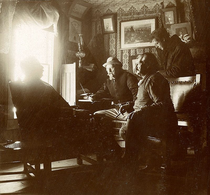 Even on vacation with his friends around him, Cody conducts his business from a desk at the ranch. Dr. Frank "White Beaver" Powell, Irving R. Bacon, and "Professor Lennon" enjoy their cigars while discussing mining prospects with the Colonel. MS 6 William F. Cody Collection, McCracken Research Library. P.6.546.46