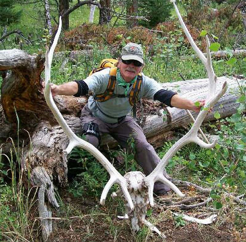 Burt Bradley and the remains of an unfortunate Yellowstone elk, a victim of winter kill or old age. Photo courtesy Jeremy Johnston.