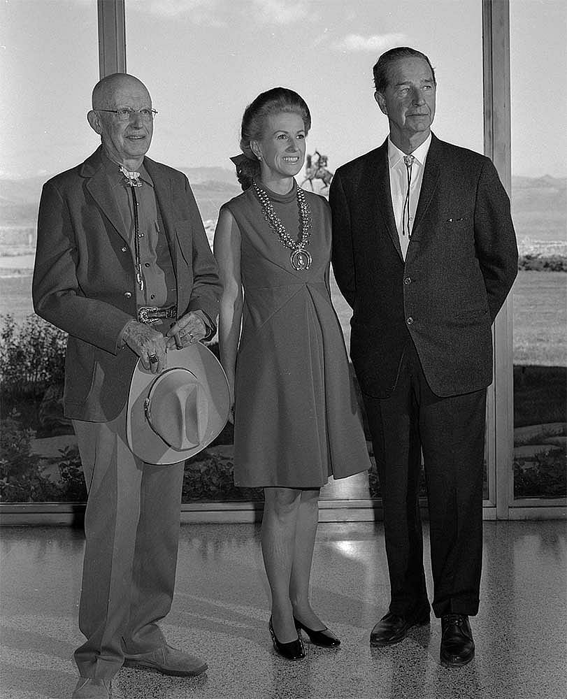 Fig. 10: Museum Director Harold McCracken (L) and Marylou and Cornelius Whitney in the Whitney Gallery of Western Art, September 15, 1968. MS 089 Jack Richard Photograph Collection, McCracken Research Library. PN.89.50.10158.11