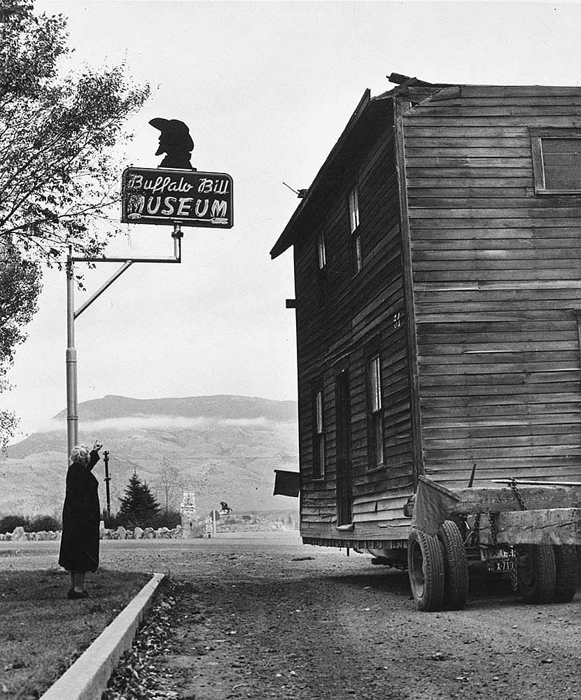 Fig. 3: Buffalo Bill's boyhood home arrives at the original Buffalo Bill Museum under the watchful eye of Curator Mary Jester Allen. MS 6 William F. Cody Collection, McCracken Research Library. P.69.1381