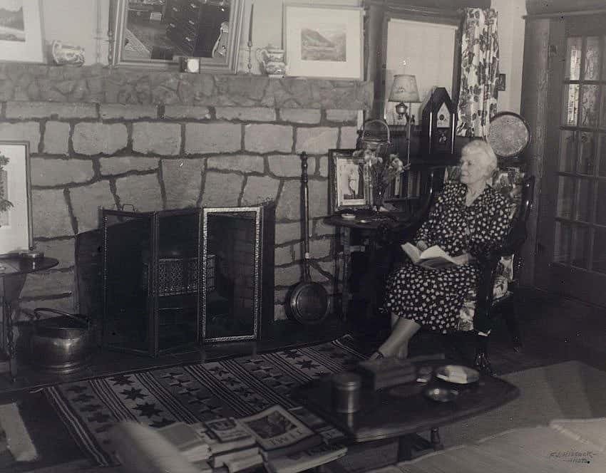 Mary Jester Allen in front of the fireplace in the Buffalo Bill Museum, 1953. Mrs. Allen actually lived in the museum from the time of its construction until her death in 1960. Mary Jester Allen Collection. P.69.570