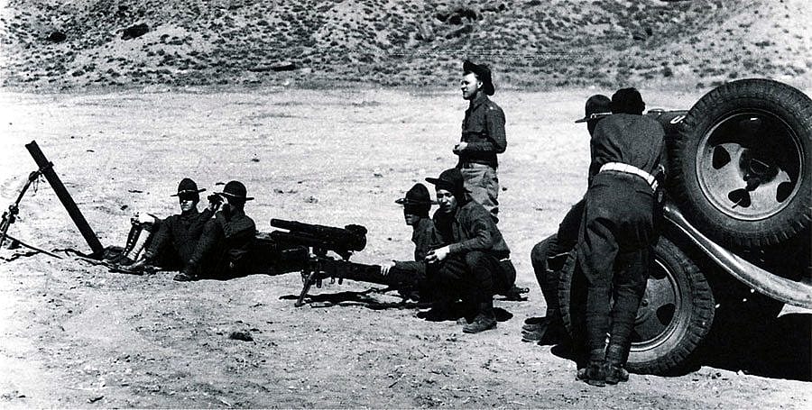 Howitzer Company, 163rd Infantry, Montana National Guard, waiting for orders to fire upon Durand's mountain fortress. Sturm photo.