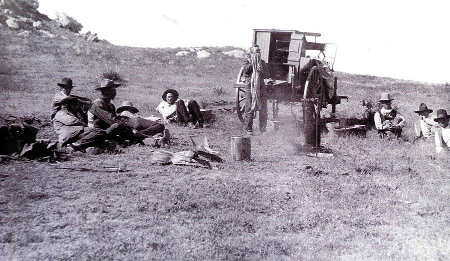 N.C. Wyeth (1882-1945). "Mooney-Cook, Jim Peterson. Dale Middlemist (men around chuck-wagon)," October 1904. Photograph courtesy Colorado Historical Society. F26,272