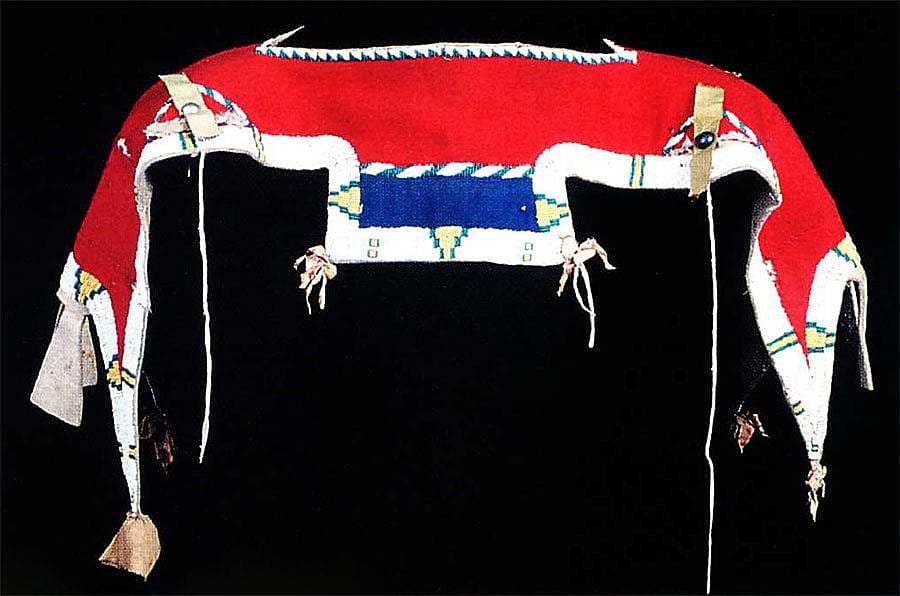 Woman's dress yoke, ca. 1870-1880. Tanned hide, trade cloth, glass beads. Fort Lewis College, Center of Southwest Studies.