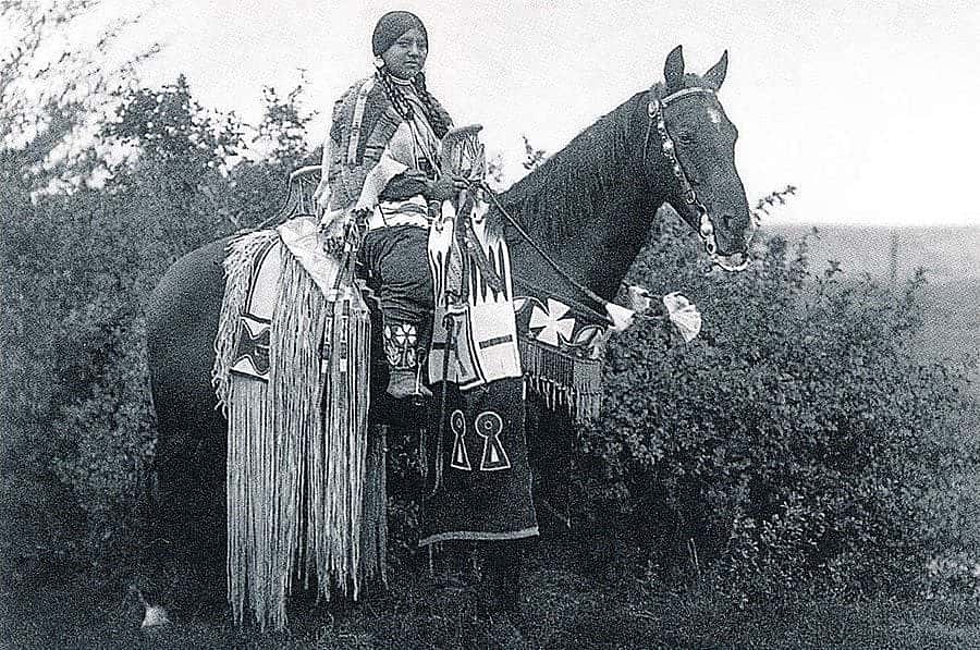 Cayuse woman rider on horseback. Photograph by E.S. Curtis from "The North American Indian." Gift of Douglas L. Manship.