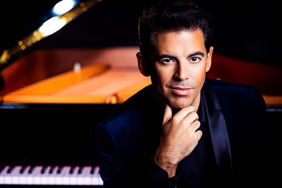 Tony DeSare in front of piano. Photo by Matt Baker.