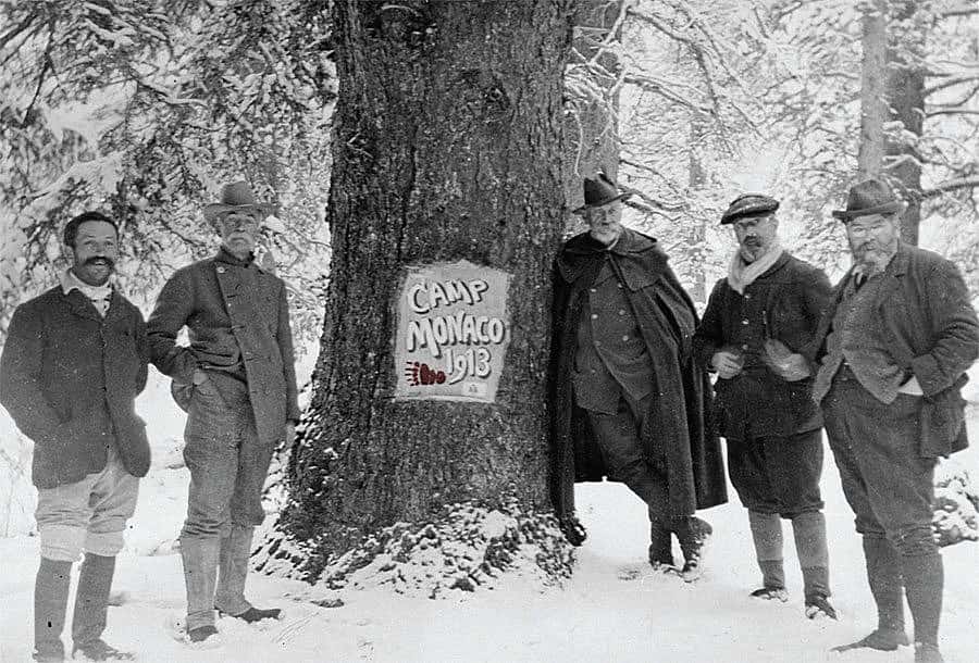 Camp Monaco, near Buffalo Bill's hunting lodge, northwest Wyoming, September 1913. Prince Albert I leans on the Camp Monaco tree. MS6 William F. Cody Collection. P.69.0296