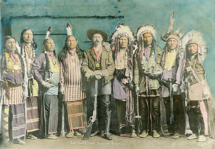 A large number of images of Native Americans in Buffalo Bill's Wild West are posed photographs, some even in studios. Tom F. Cunningham describes how a special image he saw was anything but staged. (Hand-tinted photograph of William F. "Buffalo Bill" Cody with his "Indian Friends," ca. 1886. MS 6 William F. Cody Collection, McCracken Research Library. P.69.813)