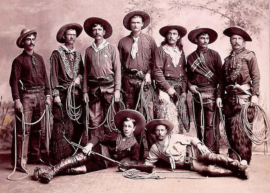 In this ca. 1886-1887 photograph, nine cowboys from Buffalo Bill's Wild West show are pictured in their western finery. Nye contended their glamorous life on the road with the show would lead youth astray. P.6.86