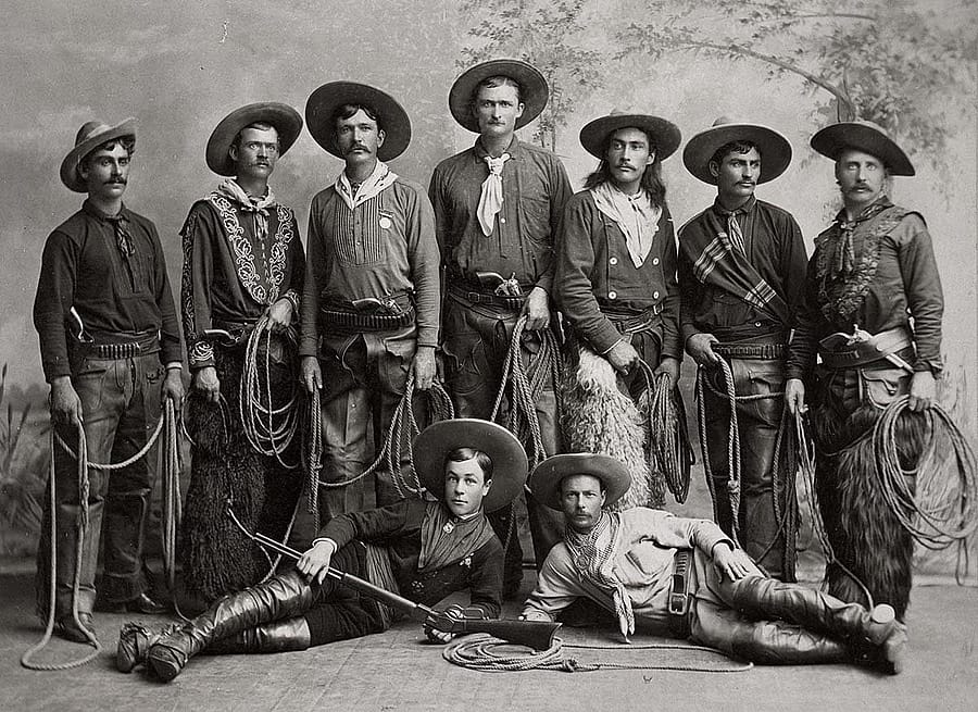 Young cowboys from Buffalo Bill's Wild West, 1886, posing with their guns and chaps. MS 6 William F. Cody Collection. MS 6 William F. Cody Collection, McCracken Research Library. P.6.86