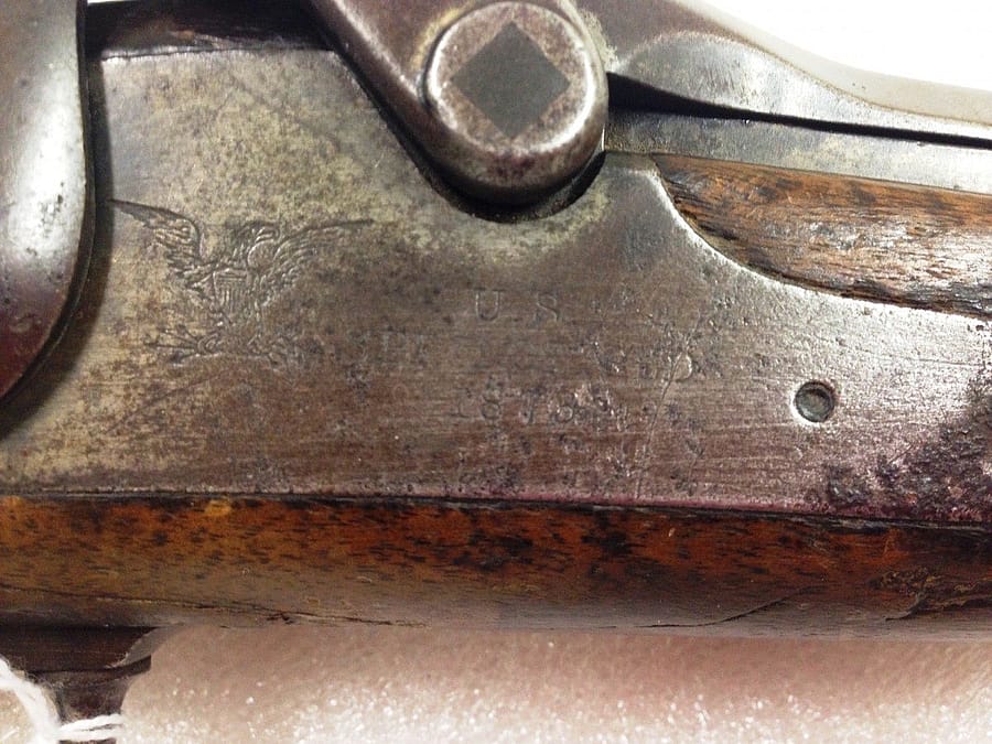 Difficult-to-read inscriptions on the receiver of a U.S. Springfield Model 1873 "Trapdoor" Carbine