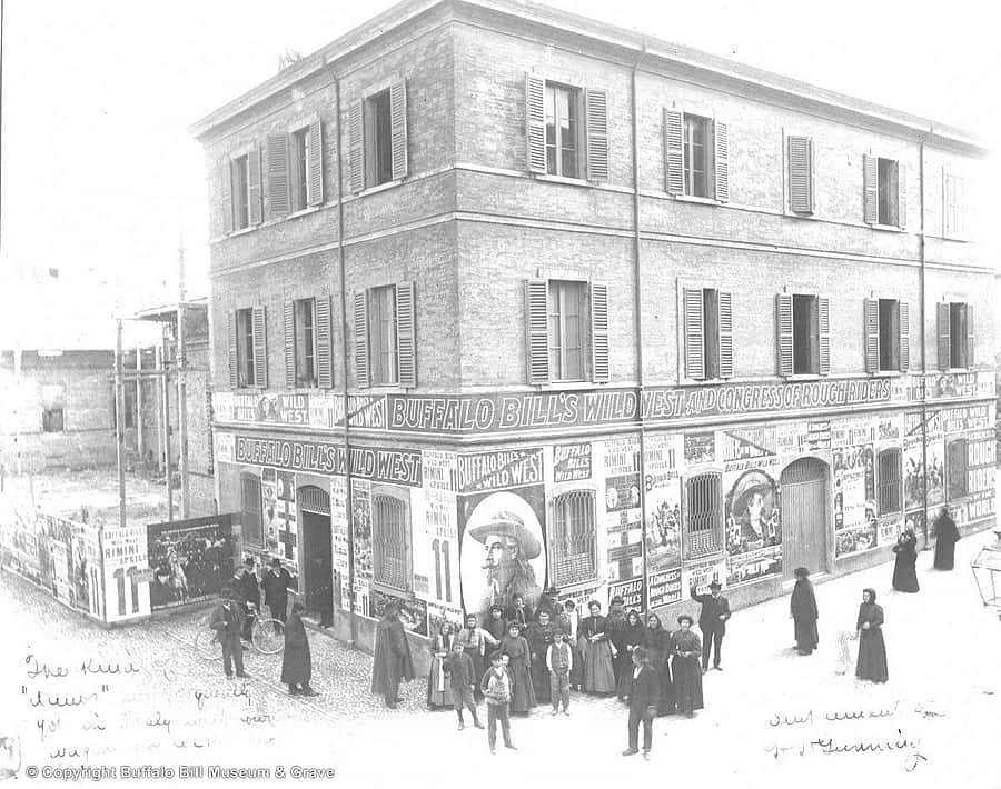 Buffalo Bill's Wild West Posters cover a building in Rimini, Italy
