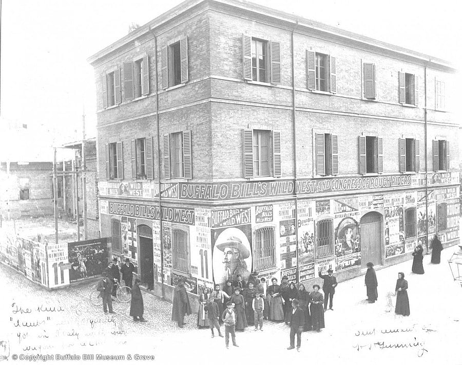 Buffalo Bill's Wild West Posters cover a building in Rimini, Italy
