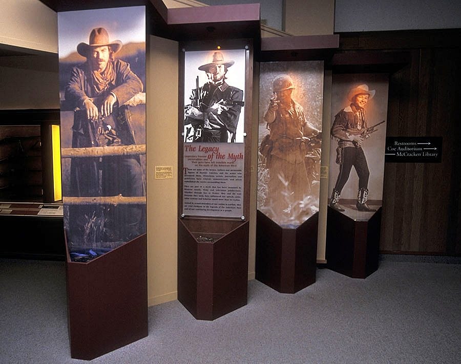 Colt firearms are popular in westerns. Tom Selleck, shown here as "Quigley Down Under," attended the opening of the exhibition.