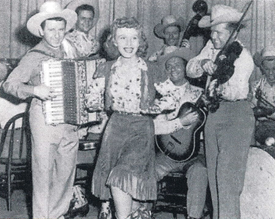Pee Wee King & His Golden West, featured on WLS National Barn Dance, with Carolyn Cotton who appeared on Hollywood Barn Dance. Cowboy Songs Archive. Gift of Janet McBride.