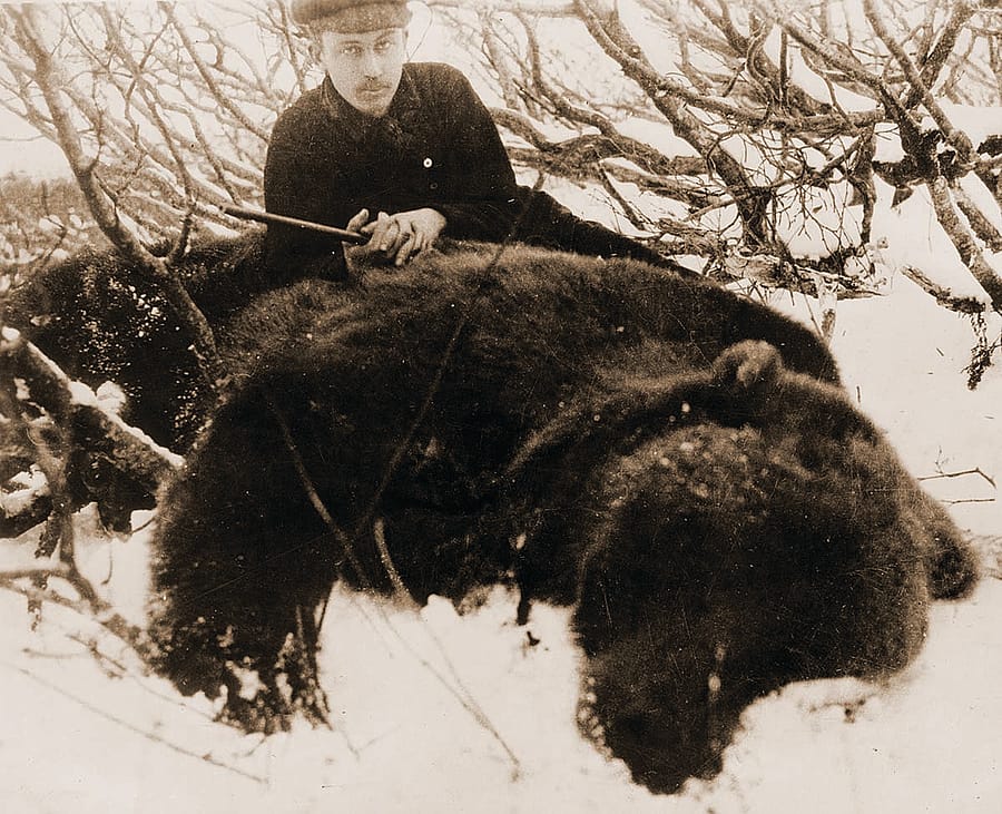 Fig. 6: Harold McCracken with the product of a 1916 hunt, one of the largest Alaskan grizzly bears in recorded hunting history. MS 305 Harold McCracken Photograph Collection, McCracken Research Library. P517