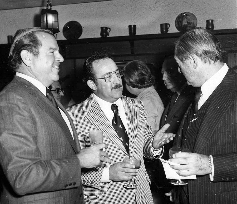 Jim Minter (center) visits with trustee Charles Duncan (left) and 21 Club owner, Peter Kriendler, at the spring 1976 reception with Winchester executives at the 21 Club. PN.20.2683