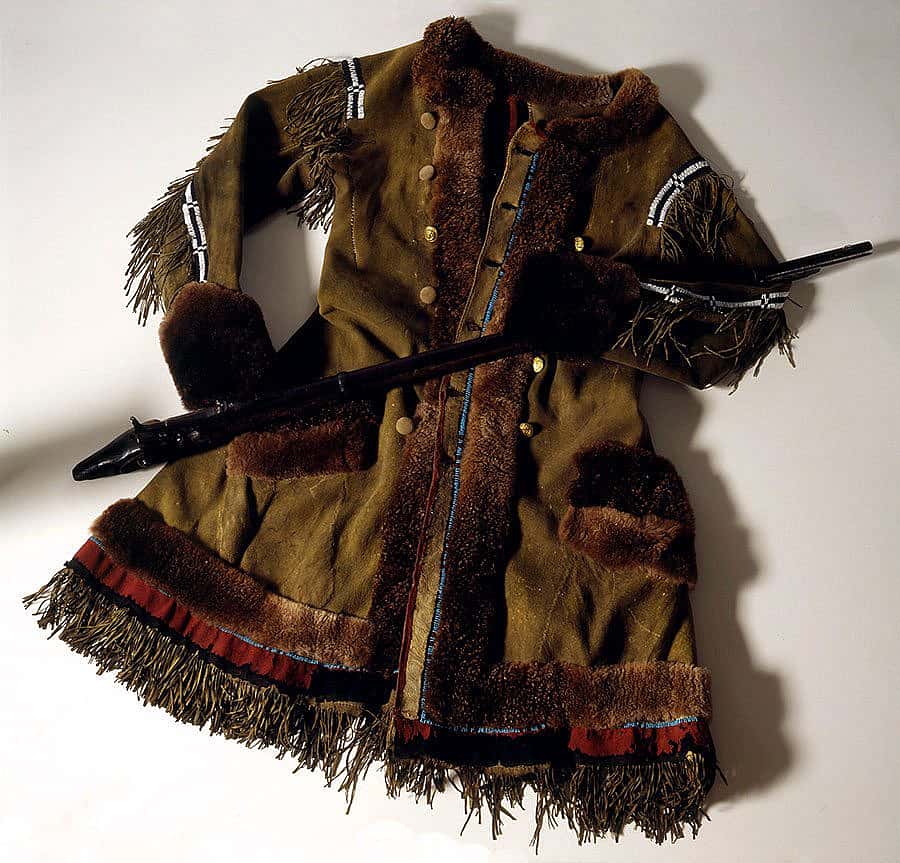 One of Buffalo Bill Cody's frontier, buffalo hide coats, and the stock of his Springfield Model 1866 trap-door rifle. 1.69.768 and 1.69.366