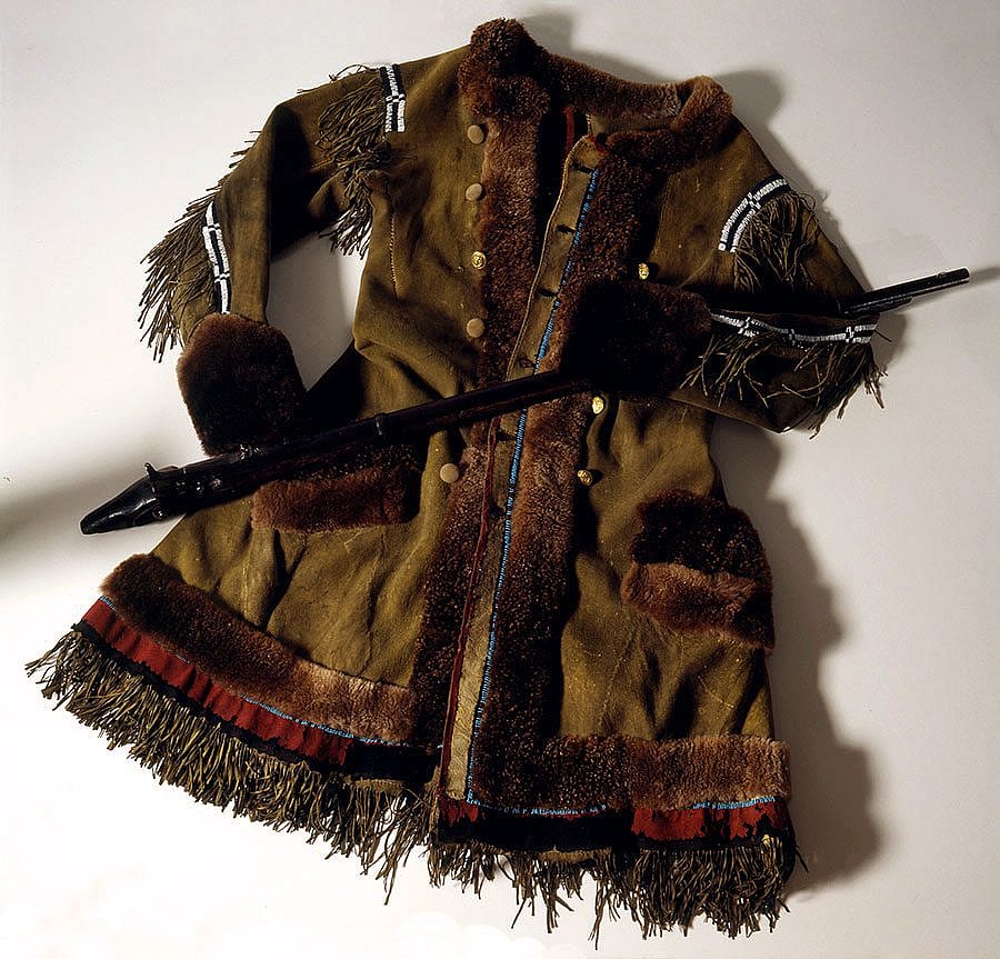 One of Buffalo Bill Cody's frontier, buffalo hide coats, and the stock of his Springfield Model 1866 trap-door rifle. 1.69.768 and 1.69.366