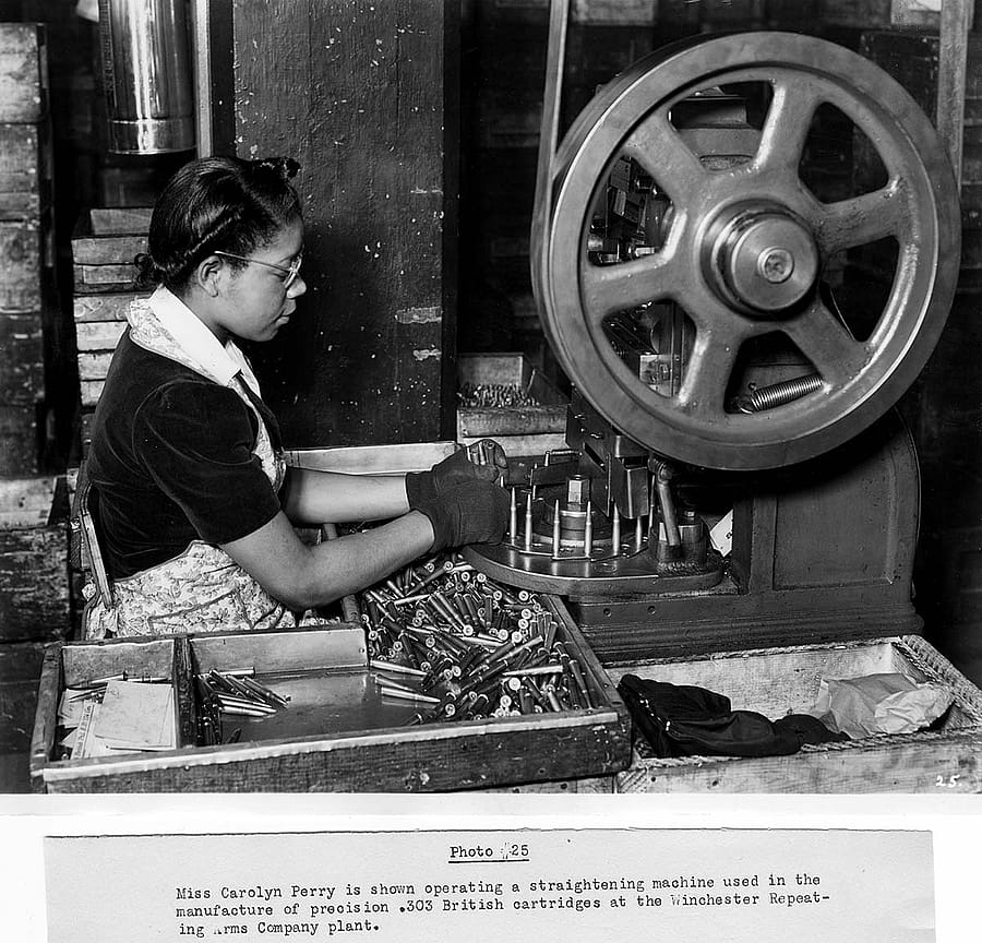 Operating a straightening machine used in making .303 British cartridges, Winchester plant operations in making the M1 Garand. MS 20 Winchester Repeating Arms Company Archives Collection, McCracken Research Library. P.20.3038.1