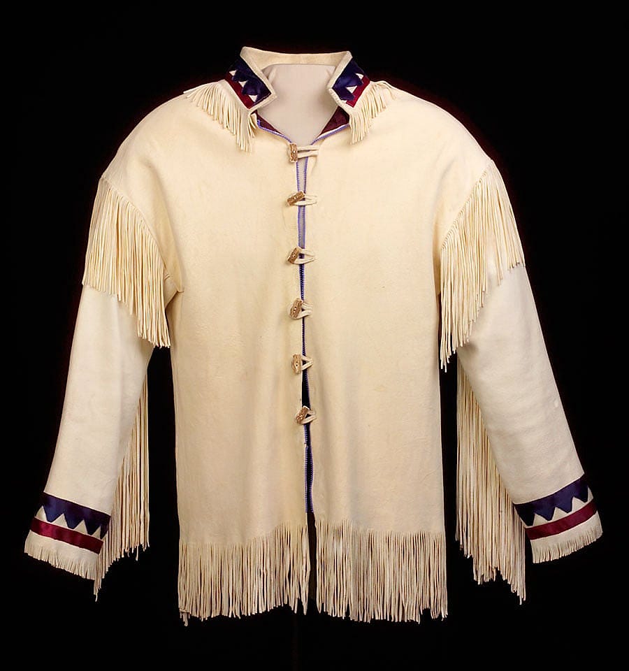 This jacket featuring colorful ribbon work and soft tanned deerskin is an example of the simple elegance characteristic of southern Plains. Jacket. Vanessa Paukeigope Jennings, Kiowa and Apache, Fort Cobb, Oklahoma, early 1980s. Tanned deerskin, ribbons, glass beads, horn. Temporary loan from B. Byron Price.