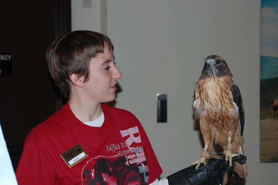 Sarah, an intern at the Buffalo Bill Center of the West, with Isham, the hawk.