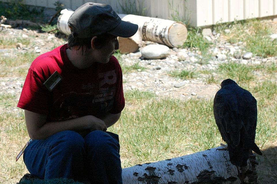 Suli and a trainer at the Buffalo Bill Center of the West rest in the shade.