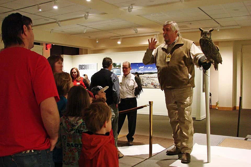 Bud telling our visitors about Teasdale, our great-horned owl. 
