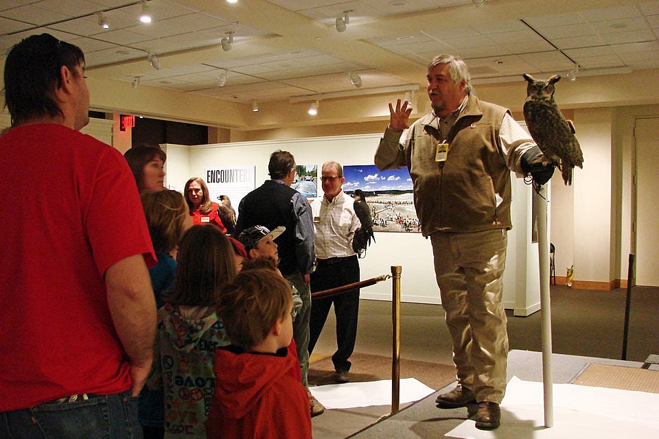 Bud telling our visitors about Teasdale, our great-horned owl. 