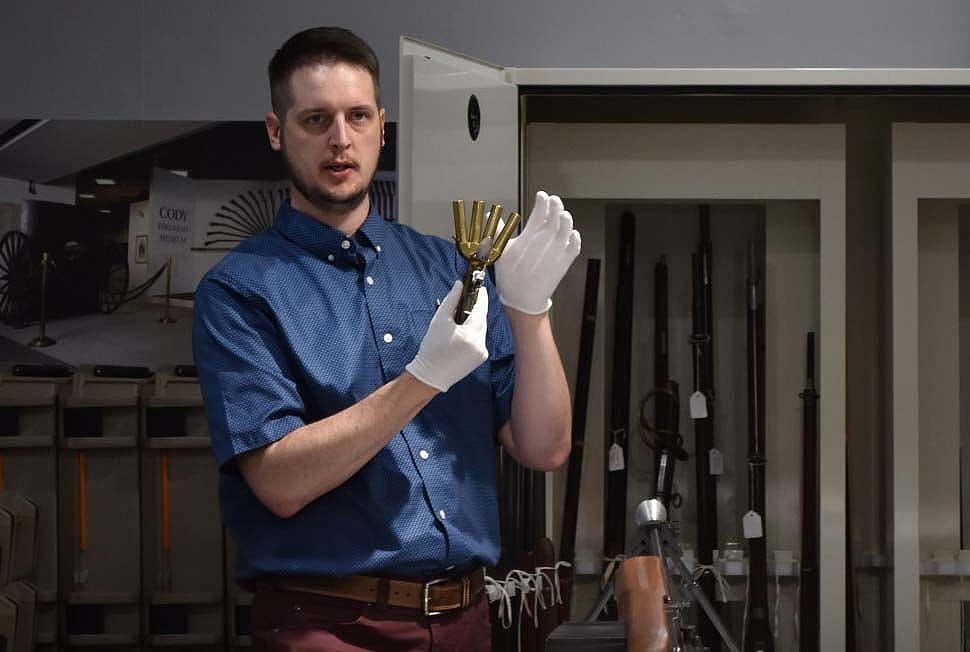 Cody Firearms Museum curator Danny Michael with "duck's foot" pistol