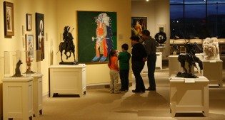 A family enjoys a Family Fun Day at the Center