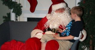 Santa visits with a hopeful child