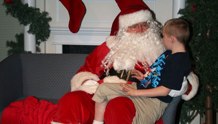 Santa visits with a hopeful child
