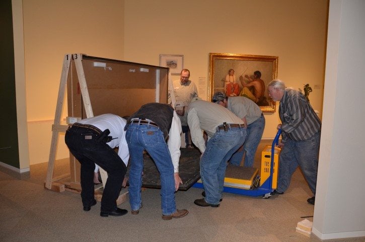 C.C. Rumsey Buffalo Hunt being removed from crate