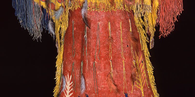 Ghost Dance dress, Southern Arapaho, c. 1890. Tanned elk hide with numerous pigments, feathers, and fringe. Chandler-Pohrt Collection. Gift of Mary J. and James R. Jundt. NA.204.4