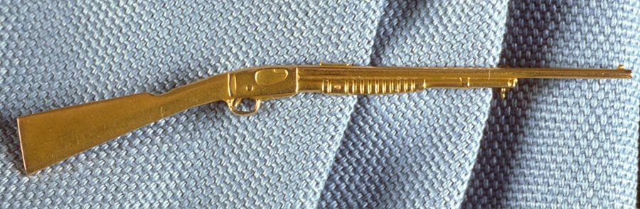 Treasures: Annie Oakley - gold rifle pin