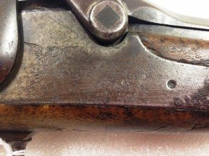 Difficult-to-read inscriptions on the receiver of a U.S. Springfield Model 1873 "Trapdoor" Carbine