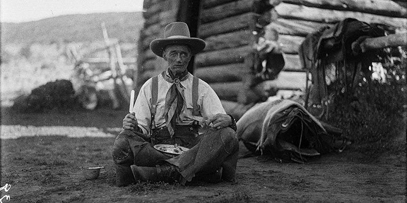 Old Charlie Collins looks a bit "worse for the wear" with his tin plate of trail vittles. Charles J. Belden, Charlie Collins, ca.1920, black and white glass plate negative. Gift of Mr. and Mrs. Charles Belden. PN.67.39