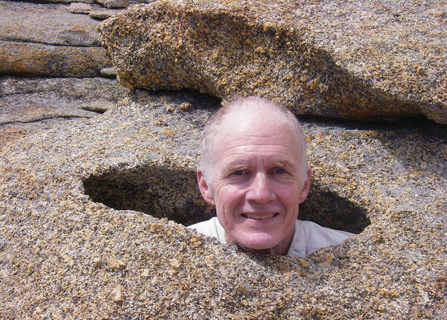 Dr. Bob Carson, shown here “immersed” in his work, speaks at the June 15 program of the Prehistory of Greater Yellowstone lecture series, co-sponsored by the Buffalo Bill Center of the West and the Greater Yellowstone Coalition.